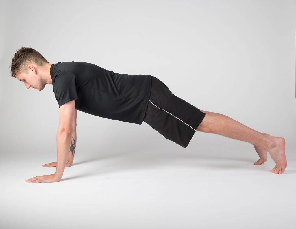 Yoga student in plank pose