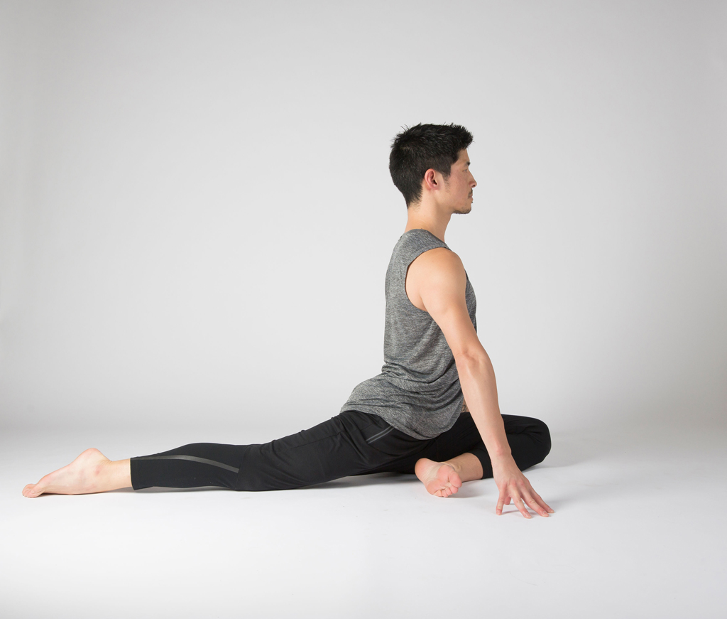 Yoga students are practicing skandasana